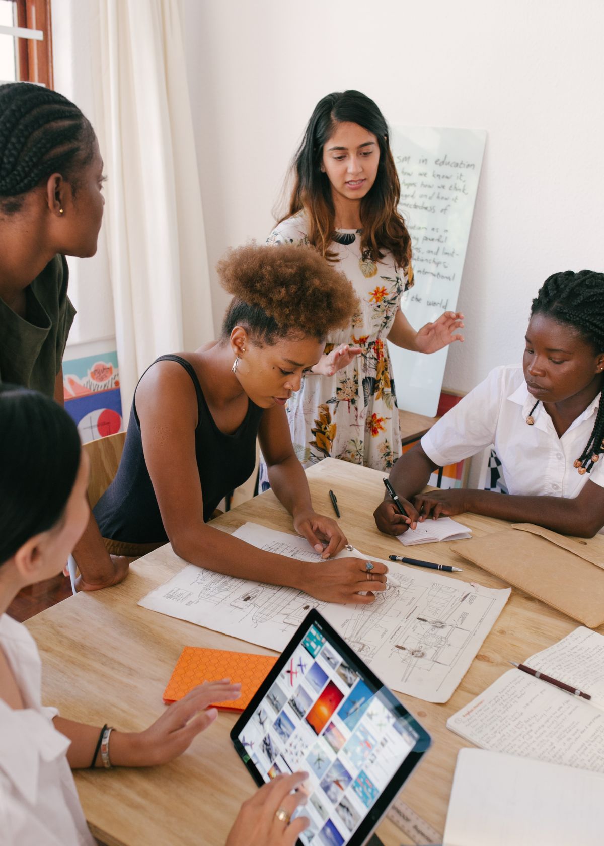 People working through an idea together